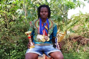 Adebayor with some of the medals he has been awarded over the years