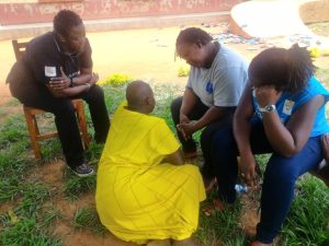 Counselors talking to one of the inmates